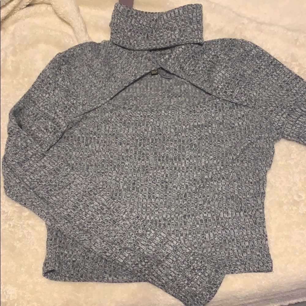 Grey cropped turtleneck with cutout